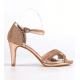 Dressy champagne mid height sandal.
